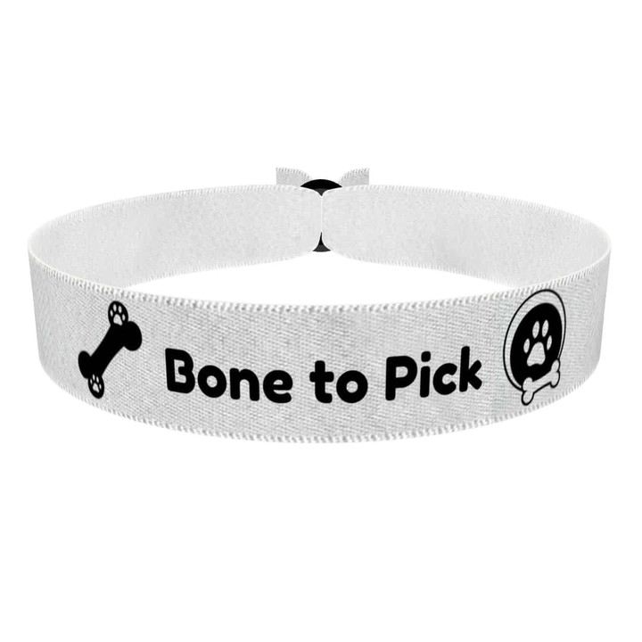 Zum Produkt Stoffarmband für Hundeliebhaber mit Knochenmotiv