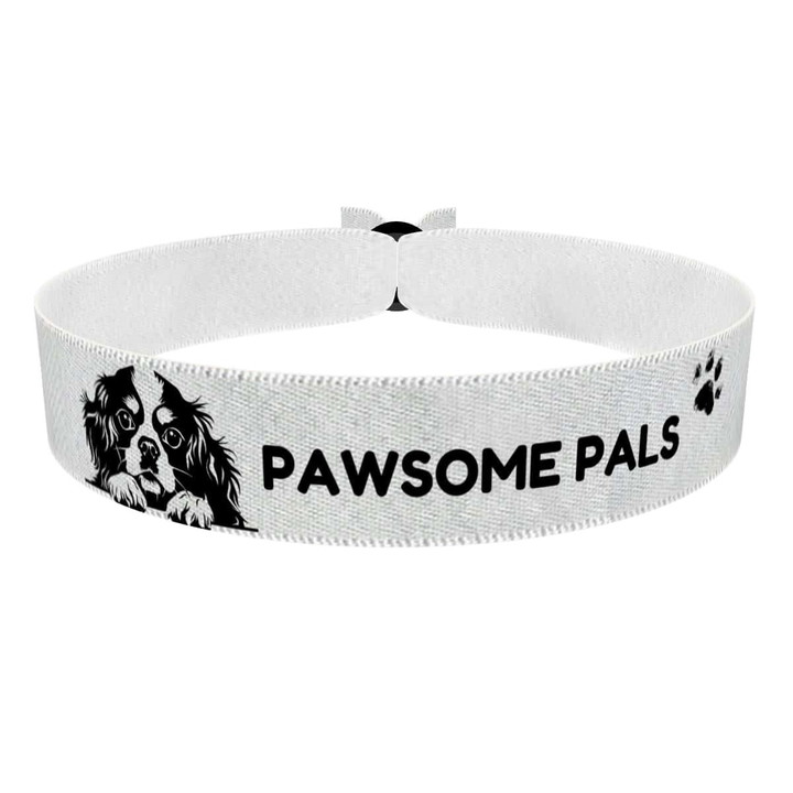 Zum Produkt Stoffarmband für Hundeliebhaber mit Pfotenmotiv