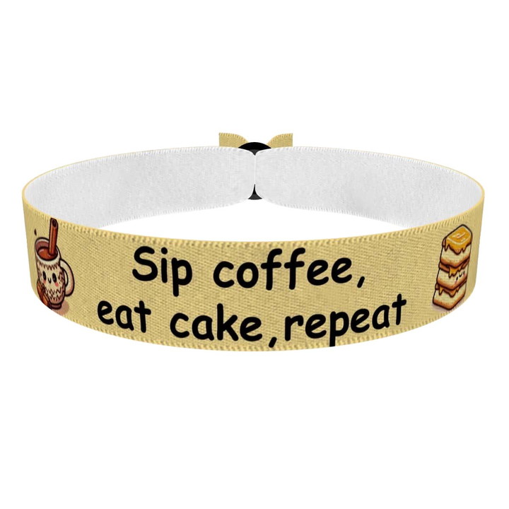 Zum Produkt Stoffarmband Sip Coffee Eat Cake Repeat Motiv
