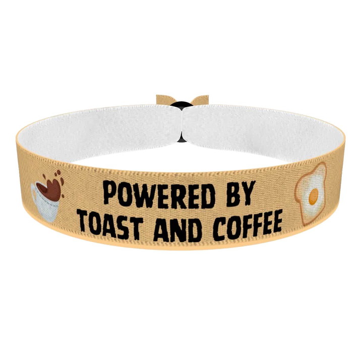 Zum Produkt Stoffarmband Powered by Toast and Coffee Motiv