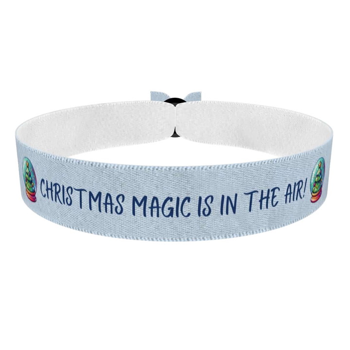 Zum Produkt Stimmungsvolle Schneekugel Weihnachtsmotiv Stoffarmband
