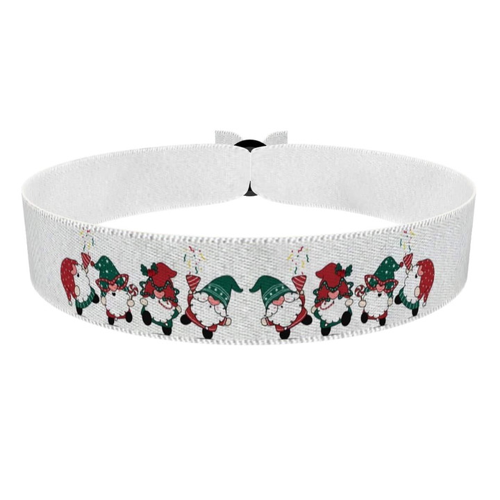 Zum Produkt Stoffarmband mit fröhlichen Weihnachtswichteln und Geschenken