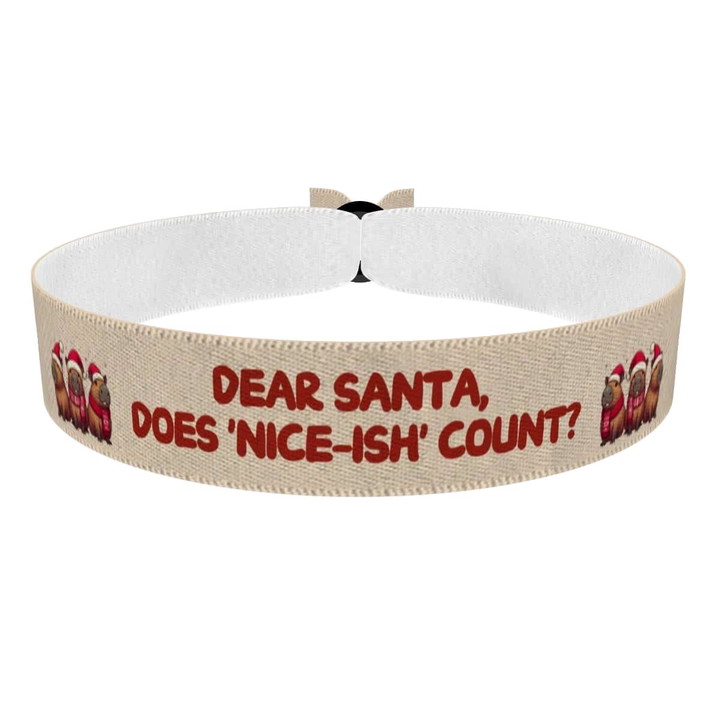 Zum Produkt Süßes Weihnachtsarmband mit lustigen Weihnachtsmotiven Stoffarmband